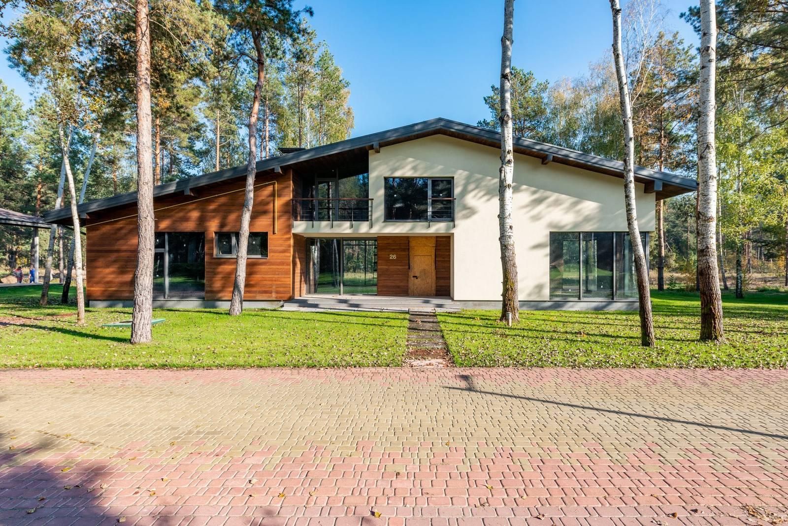 Modern home exterior surrounded by trees