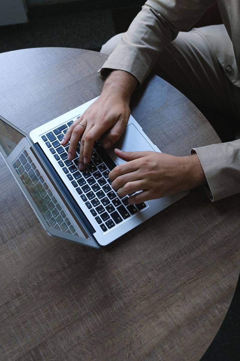 Technology professional working on a laptop in an office