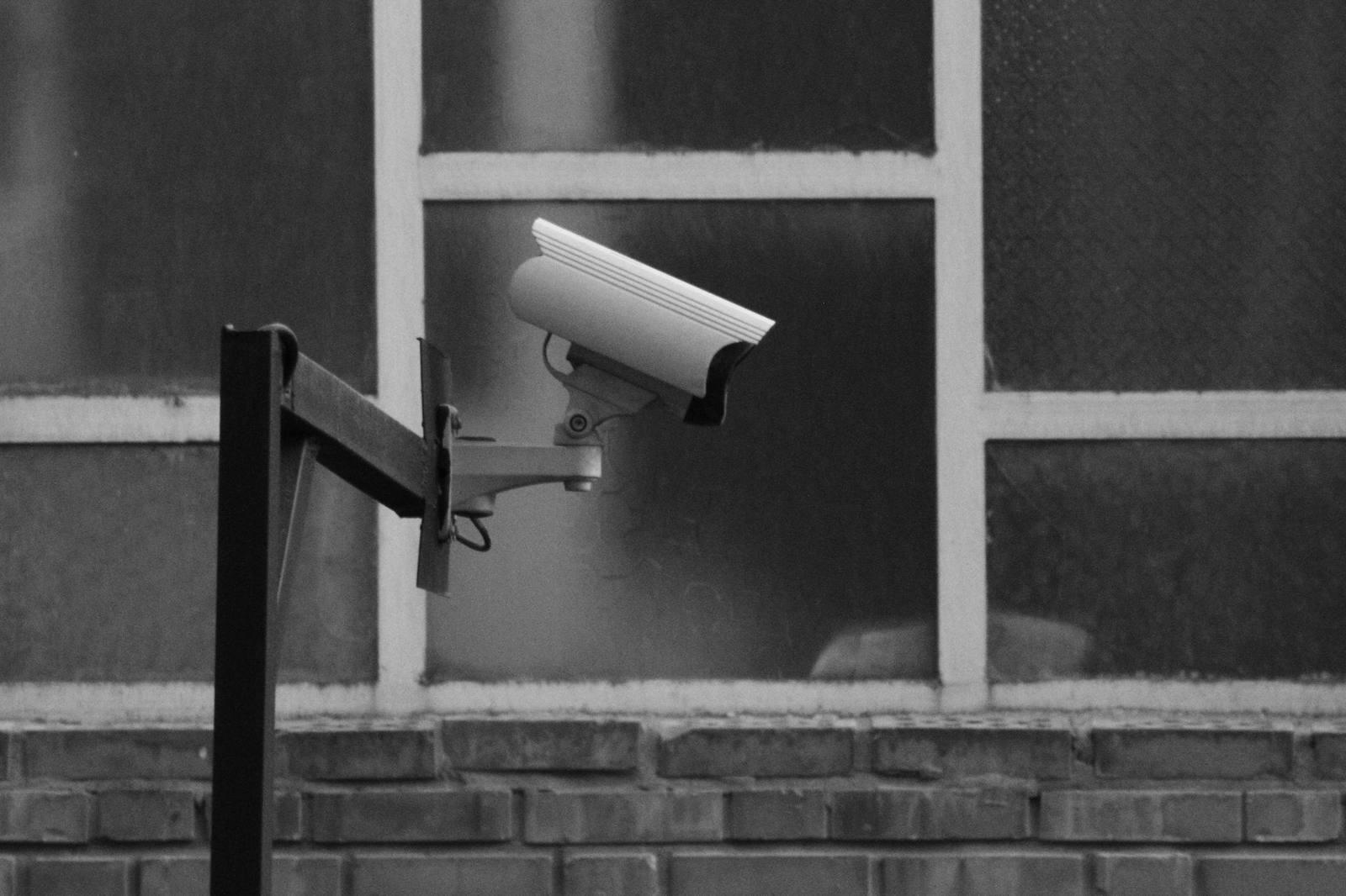 Security camera mounted on an exterior wall